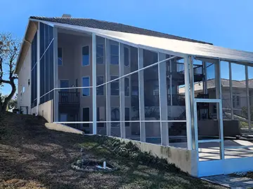 Three story pool enclosure in white - Ormond Beach